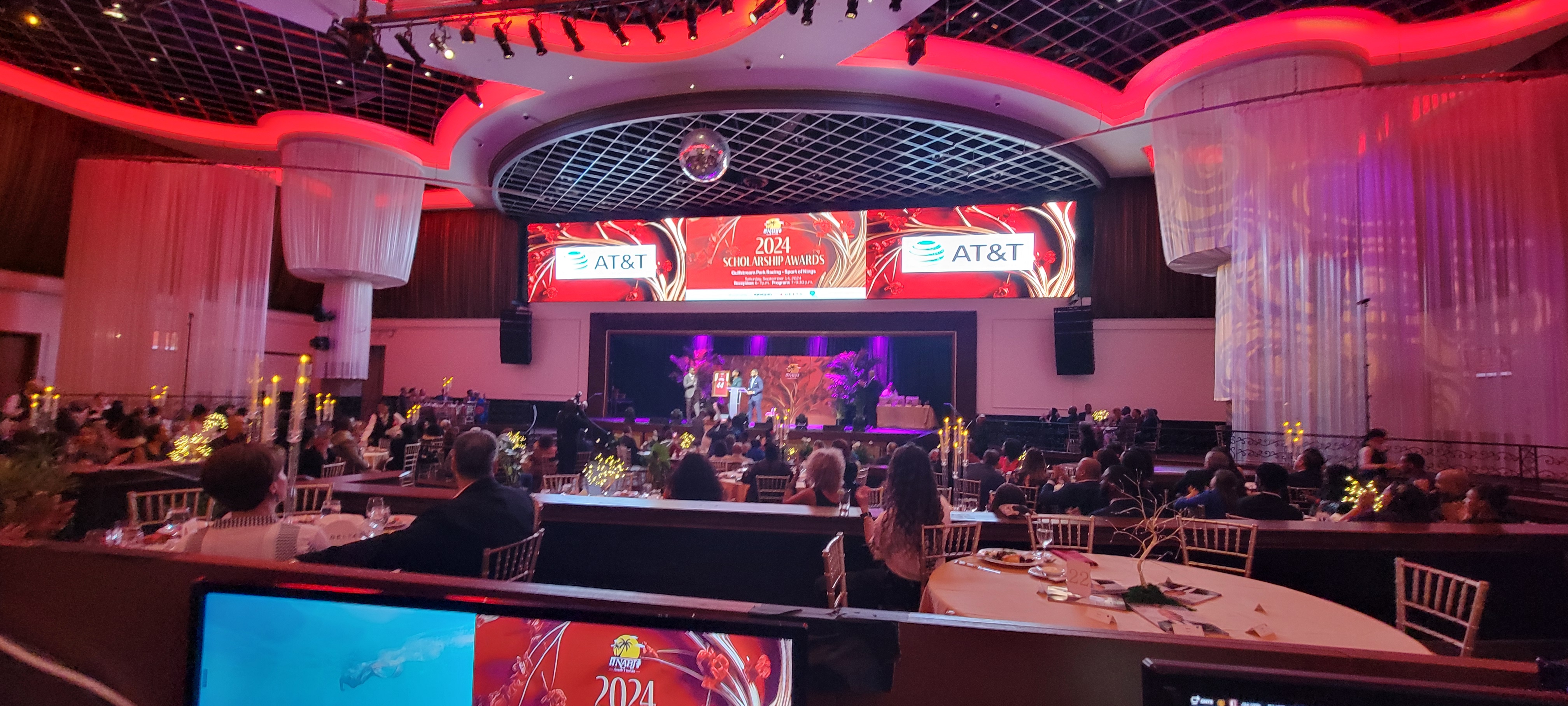 Dynamic event ambiance featuring a professionally designed program slide presentation and branded stage signage for the 2024 Scholarship Awards. Seamless integration of visual elements and lighting created an engaging and memorable experience for attendees.